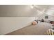 Finished attic with a window, carpet, angled ceiling, couch, chair and toys at 1951 Jim Haworth Ct, Logandale, NV 89021