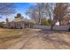 View of home's large backyard with privacy fence and attached garage at 1951 Jim Haworth Ct, Logandale, NV 89021