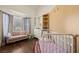 Cozy bedroom featuring a bay window, sofa, and ample closet space at 1951 Jim Haworth Ct, Logandale, NV 89021