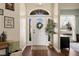 Inviting entryway with hardwood floors, decorative rug, and stylish decor at 1951 Jim Haworth Ct, Logandale, NV 89021