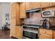 Close-up of a kitchen area featuring stainless steel appliances and light wood cabinetry at 1951 Jim Haworth Ct, Logandale, NV 89021