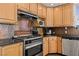 Kitchen area featuring stainless steel appliances, granite countertops, and light wood cabinetry at 1951 Jim Haworth Ct, Logandale, NV 89021