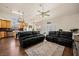 Spacious living area features hardwood floors, modern furniture, and a view into the kitchen at 1951 Jim Haworth Ct, Logandale, NV 89021
