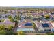 High aerial view of a desert home with solar panels and backyard patio with view of the community at 2140 Idaho Falls Dr, Henderson, NV 89044