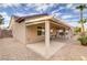 Backyard features a covered patio, stucco exterior, and desert landscaping at 2140 Idaho Falls Dr, Henderson, NV 89044