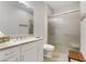 Bathroom featuring a single sink vanity, mirror and glass enclosed shower and a wooden stool at 2140 Idaho Falls Dr, Henderson, NV 89044