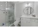 Modern bathroom with a glass shower, vanity, and patterned floor tiles at 2140 Idaho Falls Dr, Henderson, NV 89044