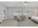 Bright bedroom with shuttered windows, a comfortable sitting area, and access to a private outdoor space at 2140 Idaho Falls Dr, Henderson, NV 89044