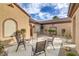 Charming courtyard with seating, desert landscaping and textured stucco walls at 2140 Idaho Falls Dr, Henderson, NV 89044