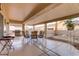 Spacious covered patio with a barbecue, outdoor seating, and desert landscaping at 2140 Idaho Falls Dr, Henderson, NV 89044