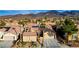 Charming home features desert landscaping, two-car garage, and solar panels for energy efficiency at 2140 Idaho Falls Dr, Henderson, NV 89044