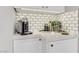 Close-up of a modern kitchen counter with a built-in coffee station and decorative accents at 2140 Idaho Falls Dr, Henderson, NV 89044