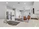 Open-concept kitchen boasts stainless steel appliances, a center island, and seamless flow into the dining area at 2140 Idaho Falls Dr, Henderson, NV 89044