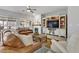Comfortable living room featuring a fireplace, TV, and a stylish entertainment center with lots of natural light at 2140 Idaho Falls Dr, Henderson, NV 89044