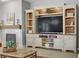 Living room showcasing built-in shelving, fireplace, and decor at 2140 Idaho Falls Dr, Henderson, NV 89044