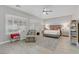 Spacious main bedroom offers shuttered windows and a serene ambiance with neutral tones and wood-look floors at 2140 Idaho Falls Dr, Henderson, NV 89044