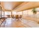 Inviting covered patio with tile flooring, ample seating, and outdoor kitchen, perfect for entertaining at 2140 Idaho Falls Dr, Henderson, NV 89044