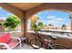 A pleasant balcony view, featuring a chair, table, and bicycle, offering a tranquil space to relax and enjoy the neighborhood scenery at 221 Mission Catalina Ln # 202, Las Vegas, NV 89107