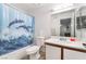 Clean bathroom with a dolphin-themed shower curtain, a white vanity, and a mirrored medicine cabinet at 221 Mission Catalina Ln # 202, Las Vegas, NV 89107