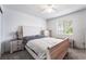 Bright bedroom featuring a full bed, neutral carpeting, a window providing natural light, and side tables at 221 Mission Catalina Ln # 202, Las Vegas, NV 89107