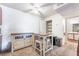 Well-lit dining area features a ceiling fan and is situated with easy access to the kitchen and bathroom at 221 Mission Catalina Ln # 202, Las Vegas, NV 89107