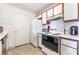 Kitchen featuring white cabinets, standard appliances, and a white refrigerator with ample space at 221 Mission Catalina Ln # 202, Las Vegas, NV 89107