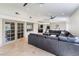 Expansive living room featuring tile flooring, recessed lighting, and a large sectional sofa, ideal for relaxation and entertaining at 221 Mission Catalina Ln # 202, Las Vegas, NV 89107
