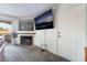 Living room with a fireplace, flatscreen television, and access to balcony area at 221 Mission Catalina Ln # 202, Las Vegas, NV 89107