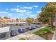 Well-maintained parking lot with assigned spots, surrounded by lush greenery and conveniently located near the buildings at 221 Mission Catalina Ln # 202, Las Vegas, NV 89107