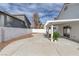 Wide concrete backyard patio with white pergola offers plenty of space for seating and enjoying the outdoors at 239 Highgate St, Henderson, NV 89074