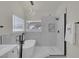 Modern bathroom featuring a sleek soaking tub, a frameless glass shower and stylish fixtures at 239 Highgate St, Henderson, NV 89074