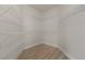 Walk-in closet with shelving and wood-look floors at 239 Highgate St, Henderson, NV 89074