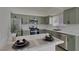Stylish kitchen with green cabinets, stainless steel appliances, and bright marble countertops at 239 Highgate St, Henderson, NV 89074