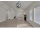Open-concept living room featuring wood-look floors and abundant natural light from large windows at 239 Highgate St, Henderson, NV 89074