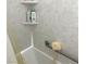 Shower featuring safety bars and corner shelving at 2441 Old Forge Ln # 103, Las Vegas, NV 89121