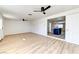 Bright living room showing new flooring, ceiling fans, and seamless flow into the kitchen at 2754 El Toreador St, Las Vegas, NV 89169