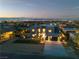 Modern home with manicured landscaping and a sleek driveway, set against the backdrop of the city skyline at 2827 Richmar Ave, Henderson, NV 89074