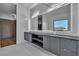 Bathroom with modern vanity, large mirror and a great view at 2827 Richmar Ave, Henderson, NV 89074
