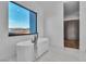 Bright bathroom featuring modern tub and view at 2827 Richmar Ave, Henderson, NV 89074