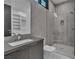 Contemporary bathroom features a walk-in glass shower, floating vanity, and large mirror at 2827 Richmar Ave, Henderson, NV 89074