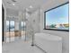 Bright bathroom featuring a modern tub and shower with a great view at 2827 Richmar Ave, Henderson, NV 89074