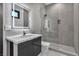 Contemporary bathroom with a tiled shower, sleek vanity, and modern lighting at 2827 Richmar Ave, Henderson, NV 89074