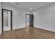 Bright bedroom with hardwood floors and an ensuite bathroom with a shower at 2827 Richmar Ave, Henderson, NV 89074