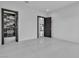 Spacious bedroom with tile flooring, neutral walls, and doors leading to other rooms at 2827 Richmar Ave, Henderson, NV 89074