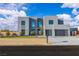 Modern two-story home featuring a minimalist design, desert landscaping, and a spacious two car garage at 2827 Richmar Ave, Henderson, NV 89074