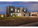 Contemporary home with desert landscaping, garage, and a minimalist modern design at 2827 Richmar Ave, Henderson, NV 89074