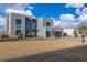 Modern home with desert landscaping, stylish gray exterior, and a convenient two-car garage at 2827 Richmar Ave, Henderson, NV 89074