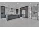 Sleek kitchen design with stainless steel refrigerator, wine rack, and a large center island at 2827 Richmar Ave, Henderson, NV 89074