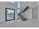 Entryway featuring modern staircase with sleek railings and a view to the outside at 2827 Richmar Ave, Henderson, NV 89074