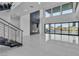 Spacious living room with modern fireplace and large windows offering views of the backyard at 2827 Richmar Ave, Henderson, NV 89074